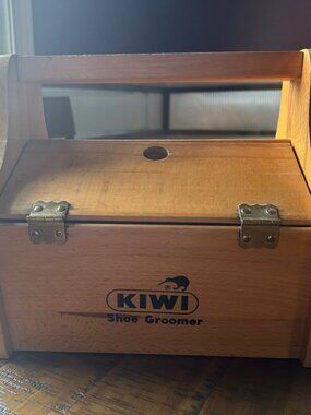 Vintage Kiwi Shoe Groomer  with built in foot rest  for storage  of brushes  ,po
